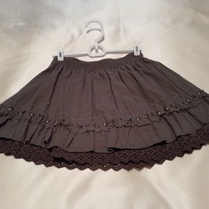 Mini skirt with scalloped lace bottom